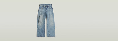 Jeans Contor Barrel Wide Pleat en corte holgado con talle bajo y pernera larga, diseño contemporáneo.