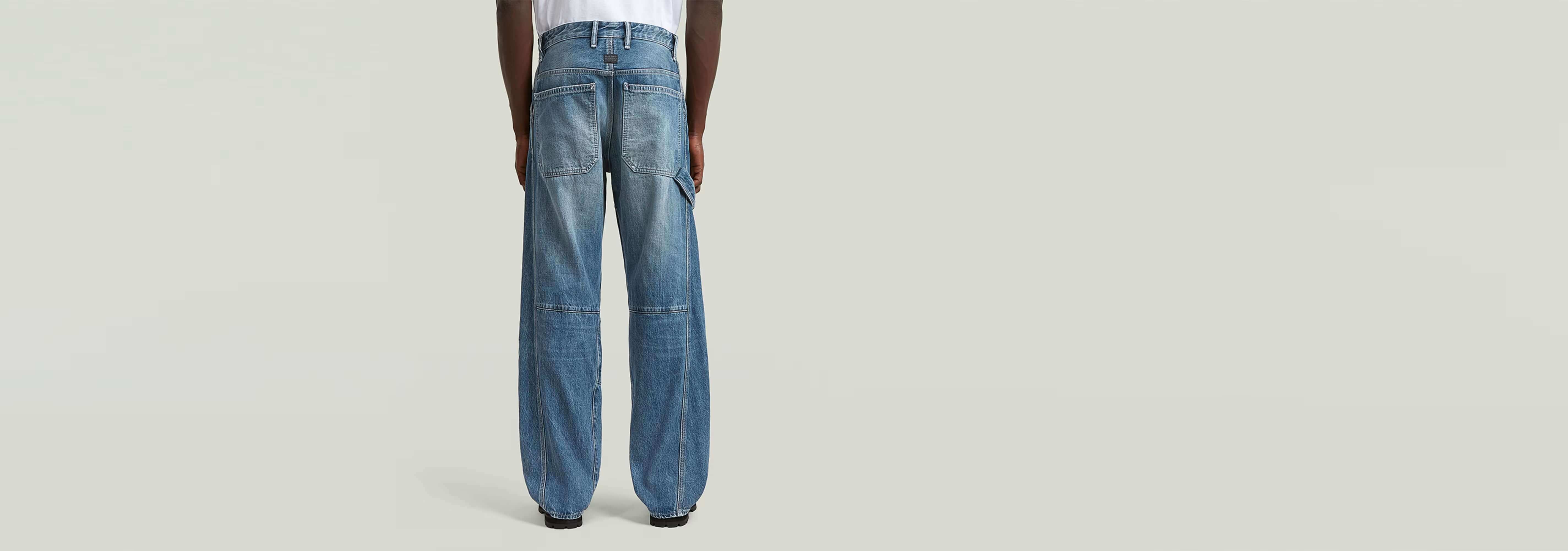 Jeans Contor Loose Carpenter mostrando la parte trasera de un diseño de corte holgado en denim greencast.