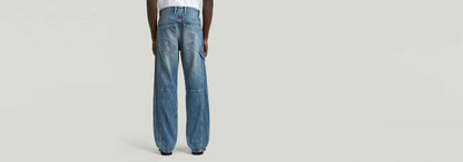 Jeans Contor Loose Carpenter mostrando la parte trasera de un diseño de corte holgado en denim greencast.