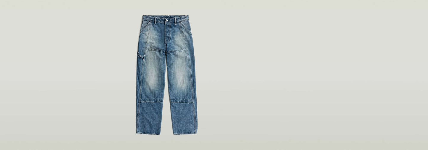 Jeans Contor Loose Carpenter en denim greencast con corte holgado y estilo de ropa de trabajo.
