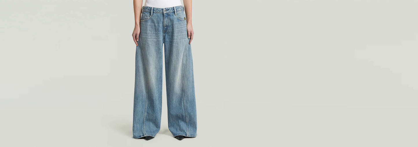 Jeans Helyx Cinch Wide: amplia silueta de pierna, cintura de talle medio y ajuste holgado, detalle de cincha trasera.