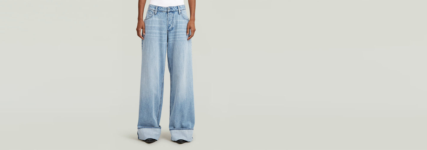 Jeans Roxx Wide de corte holgado, tiro medio y largo hasta el suelo, ideales para un estilo relajado.