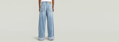 Jeans Roxx Wide, corte holgado, tiro medio, dobladillo vuelto, 100% algodón regenerativo.