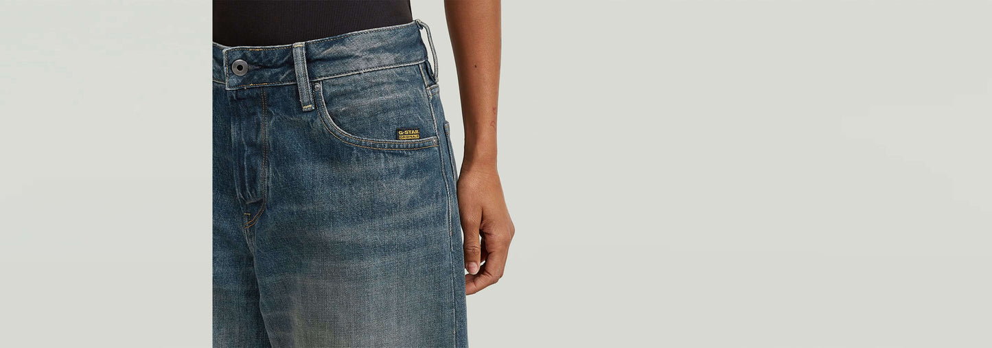 Jeans Roxx Wide en denim greencast con corte holgado y dobladillo vuelto para un estilo moderno.