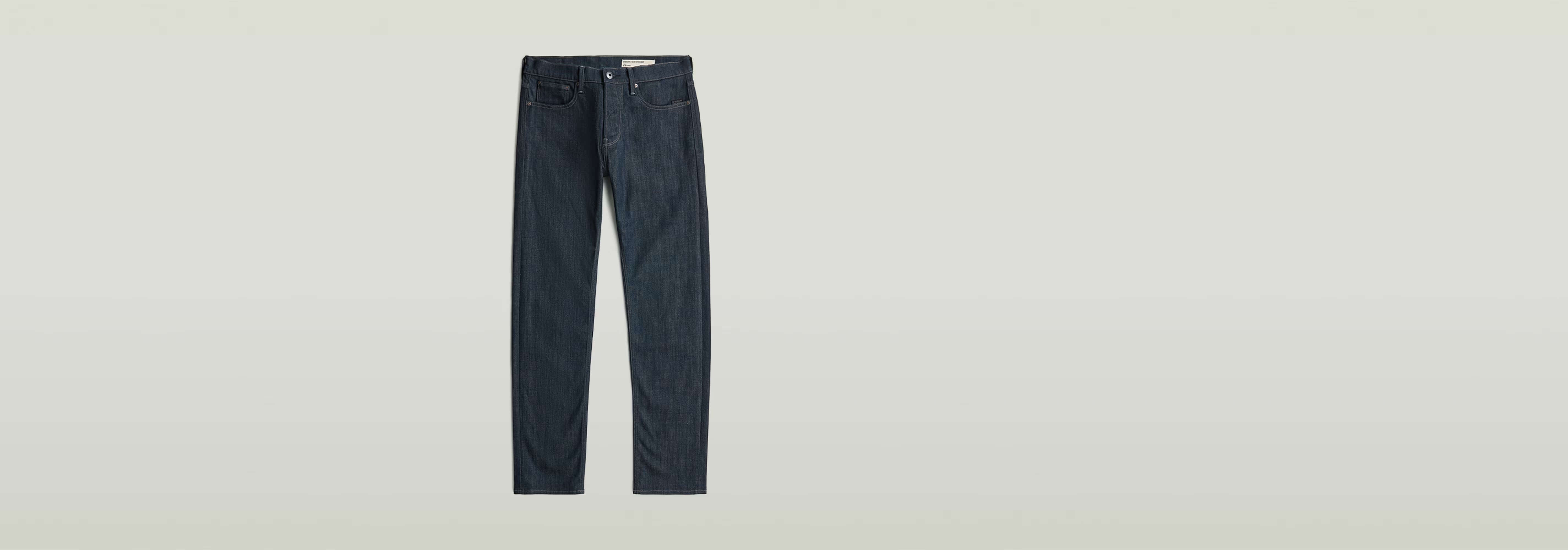 Jeans Streem Slim Tapered, modernos con corte recto ajustado y diseño de talle medio en tono índigo.