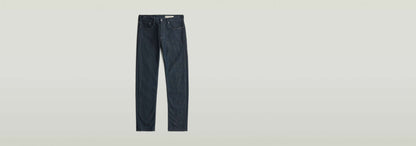 Jeans Streem Slim Tapered, modernos con corte recto ajustado y diseño de talle medio en tono índigo.
