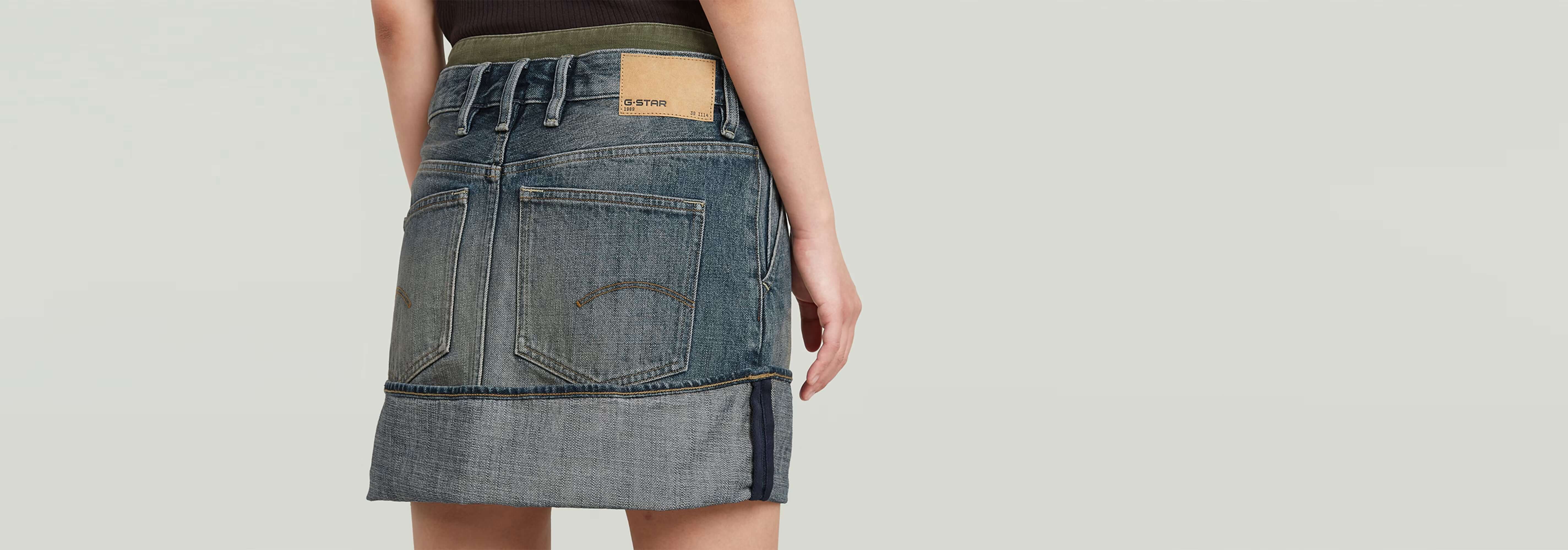 Minifalda con bajo vuelto y paneles, diseño único de bloques de color en denim greencast.