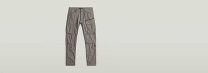 Pantalones Rovic Zip 3D Regular Tapered con cierre de cremallera y botones, diseño adaptable y varios bolsillos.
