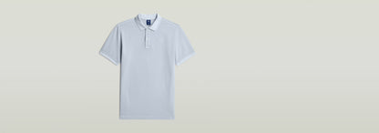 Polo Dunda Overdyed Slim con corte ajustado y cierre de polo auténtico en color claro.