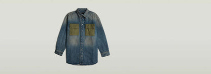 Sobrecamisa con paneles en denim greencast con diseño de bloques de color y cierre de botones a presión.