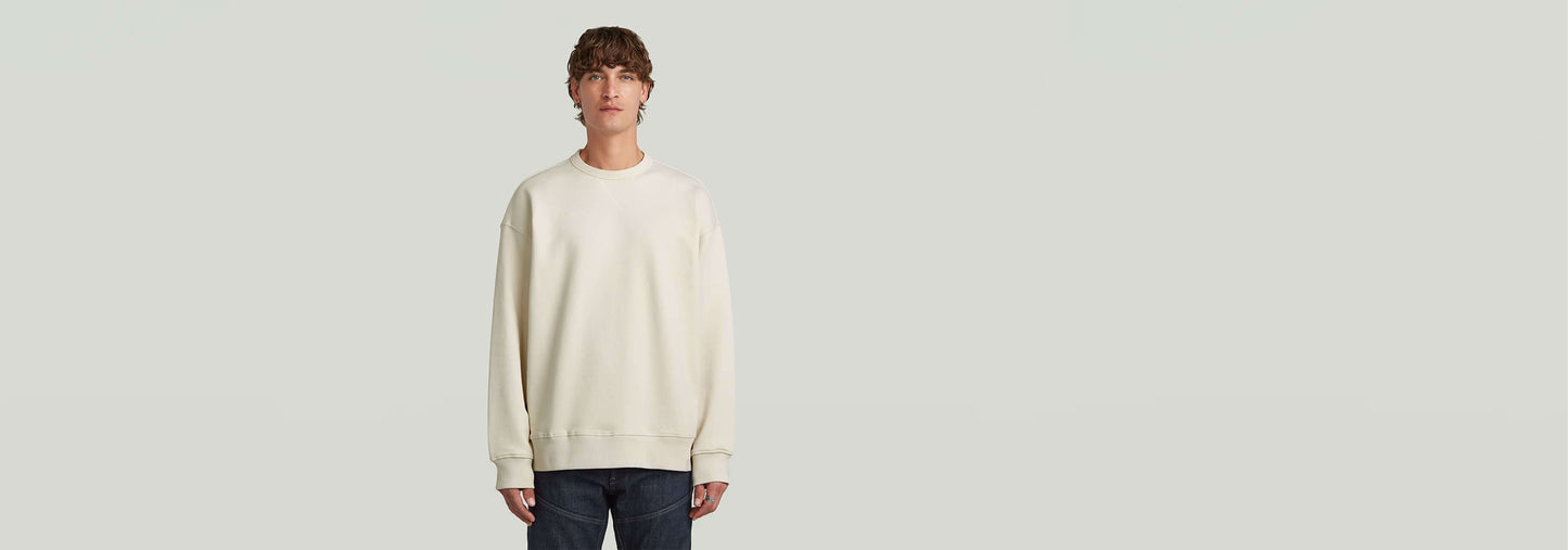 Sudadera GS-01 Relaxed en color claro, corte relajado, cuello redondo y manga larga, 100% algodón ecológico.