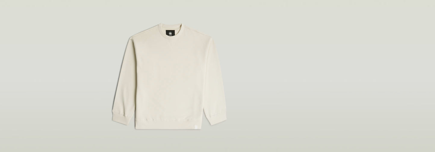 Sudadera GS-01 Relaxed en color blanco, corte relajado, cuello redondo y manga larga, 100% algodón ecológico.