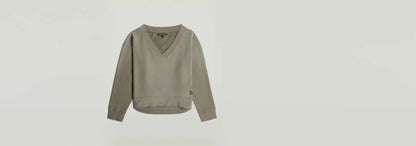 Suéter Sunfaded V-Neck Loose en color gris, con corte relajado y cuello de pico, manga larga y diseño descolorido por el sol.