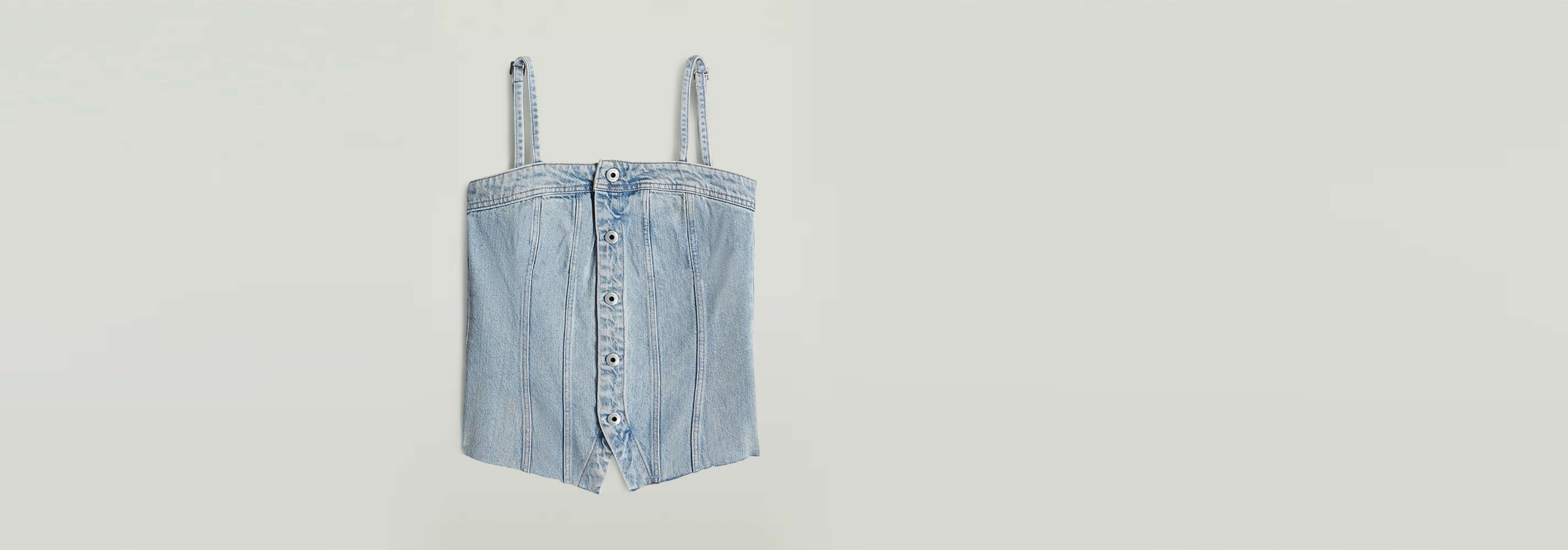 Top Kick Bustier in light blue, featuring a structured design with adjustable straps and a button closure.