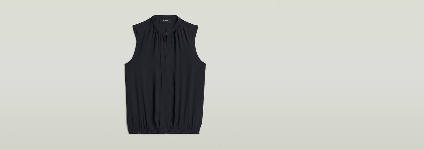 Top sin mangas Stand Up Collar en color negro con cuello mao y diseño sin mangas.