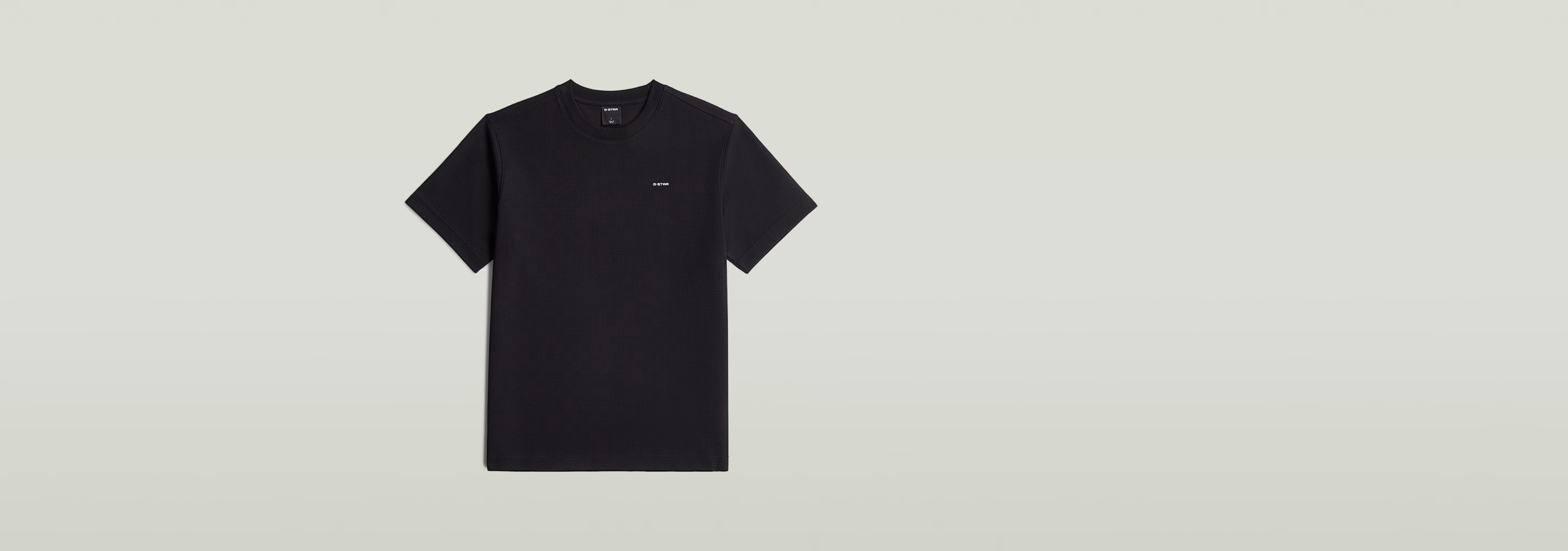 Waffle True Regular T-Shirt en color negro con cuello redondo y detalle gráfico en la parte delantera.