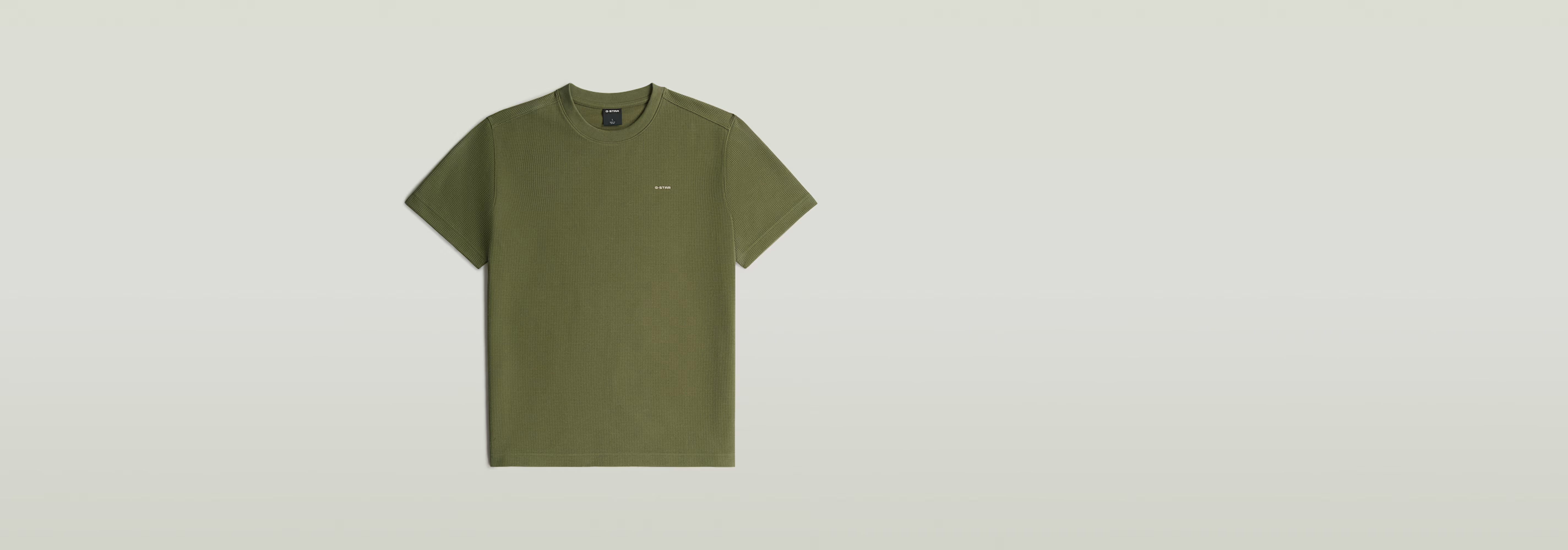 Waffle True Regular T-Shirt en color verde, con cuello redondo y manga corta, fabricado en poliéster reciclado y algodón ecológico.