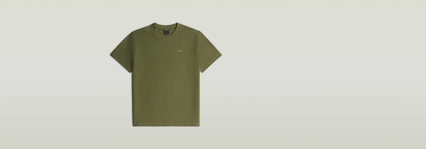 Waffle True Regular T-Shirt en color verde, con cuello redondo y manga corta, fabricado en poliéster reciclado y algodón ecológico.
